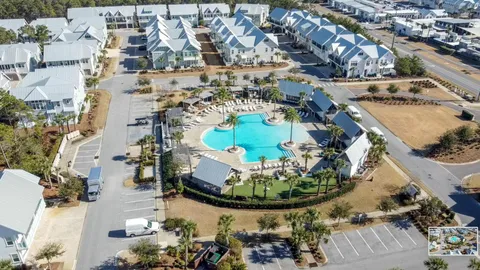 a dining room with furniture and a floor to ceiling window