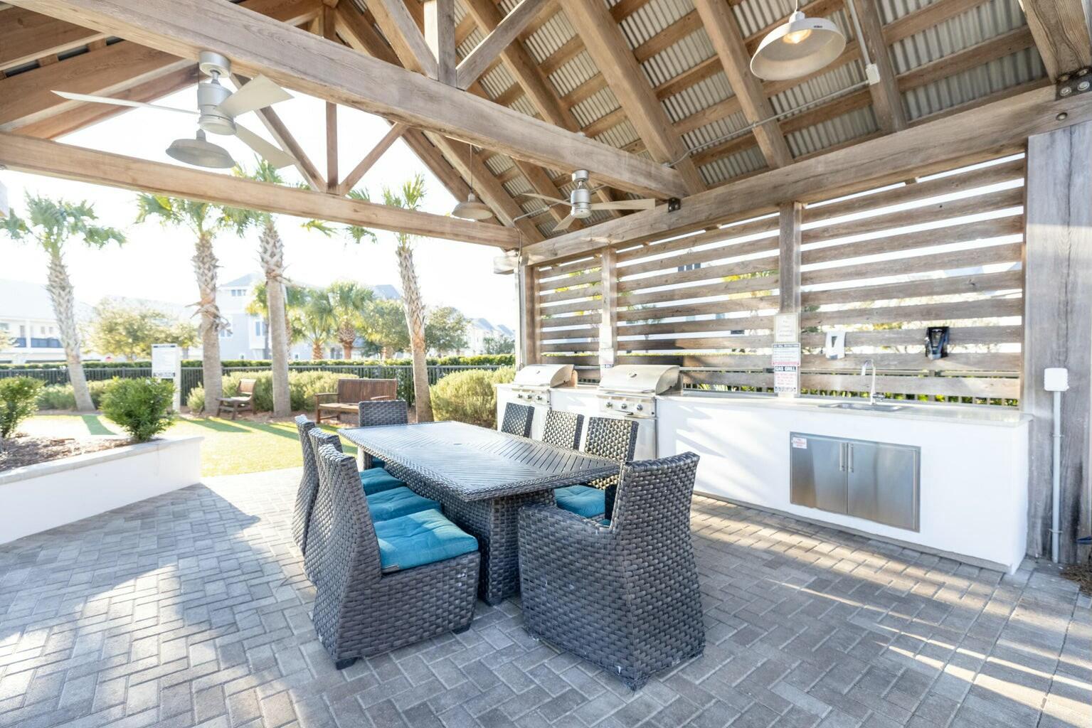 111 East Milestone Drive, Unit C Inlet Beach, FL 32461 - Photo 34 of 37 a dining room with furniture and a floor to ceiling window