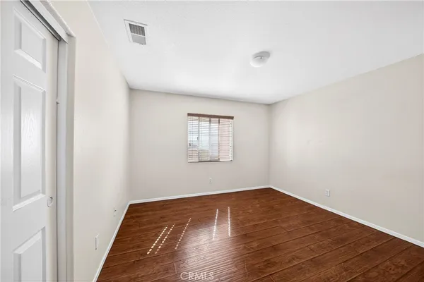 a room with a bed and a window