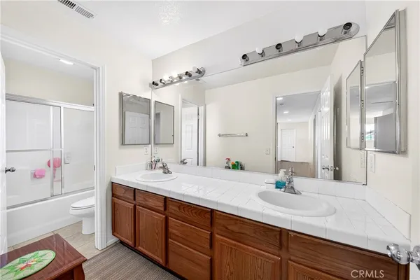 a bathroom with a shower and a toilet