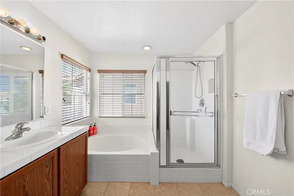 a bedroom with a bed and a shower