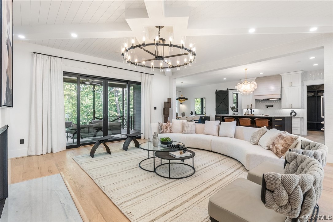 8576 Barrique Road New Kent, VA 23124 - Photo 12 of 50 a living room with furniture a dining table and a large window