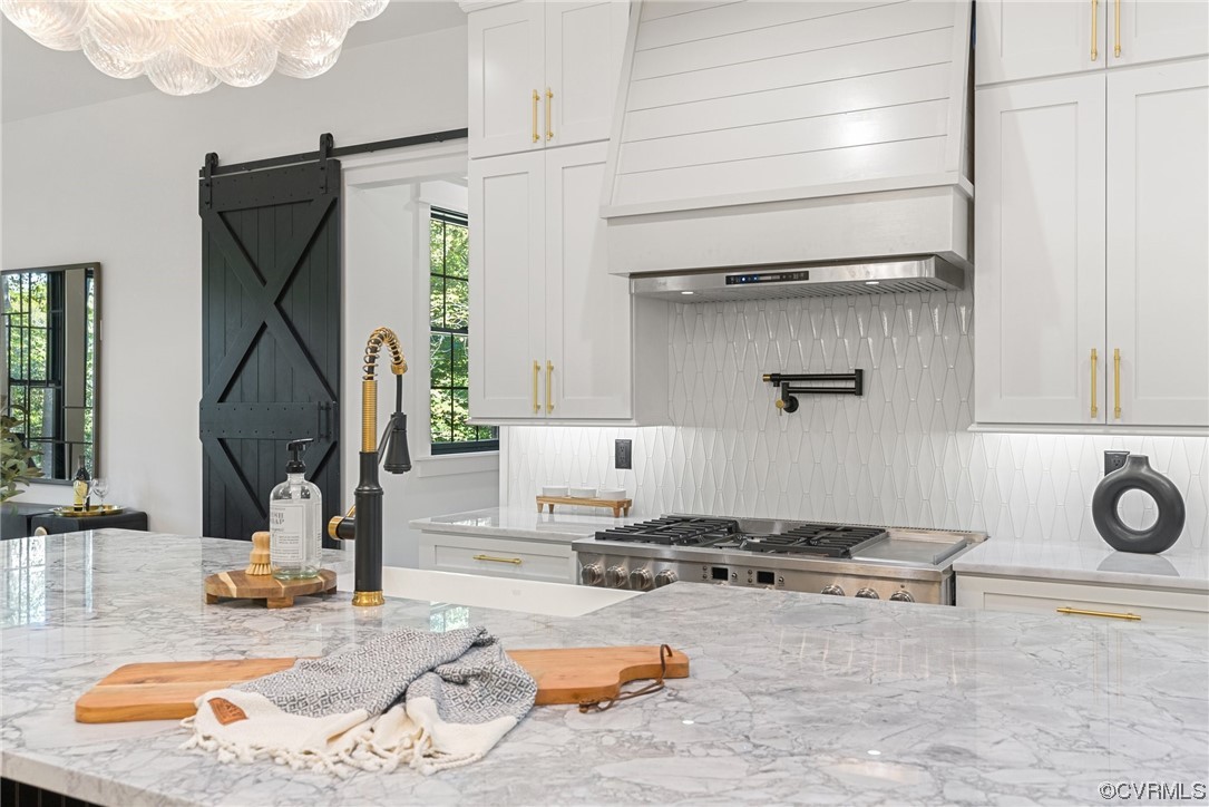 8576 Barrique Road New Kent, VA 23124 - Photo 13 of 50 a kitchen with a sink appliances and cabinets
