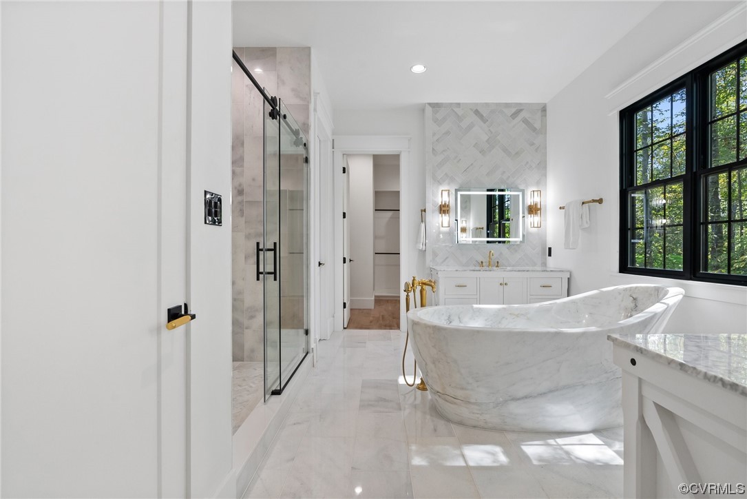 8576 Barrique Road New Kent, VA 23124 - Photo 25 of 50 a bathroom with a bathtub and a shower