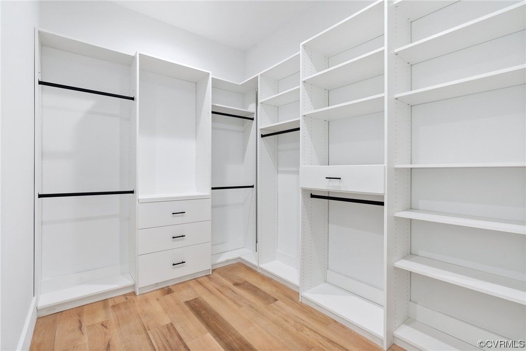 8576 Barrique Road New Kent, VA 23124 - Photo 28 of 50 a view of walk in closet with empty racks