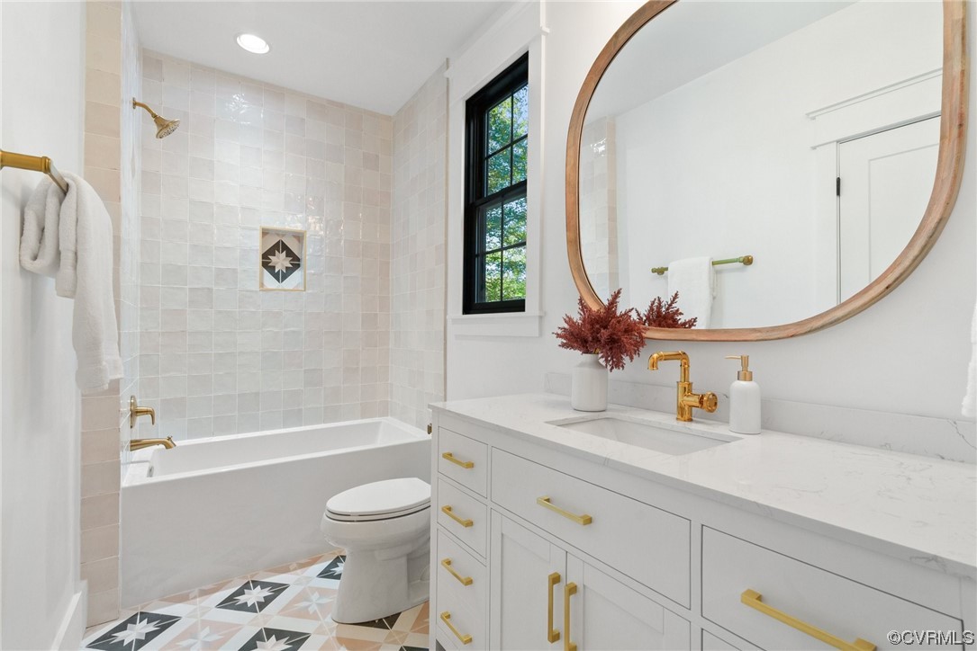 8576 Barrique Road New Kent, VA 23124 - Photo 33 of 50 a bathroom with a sink a toilet and a mirror
