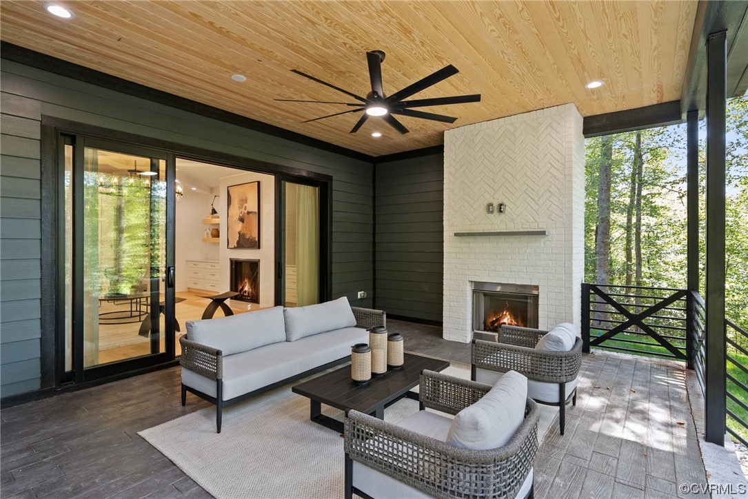 8576 Barrique Road New Kent, VA 23124 - Photo 47 of 50 a living room with furniture and a fireplace