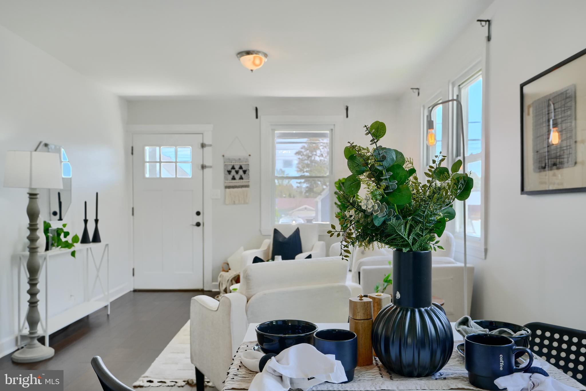 294 Stillwater Road Baltimore, MD 21221 - Photo 11 of 40 a living room with furniture potted plant and a window