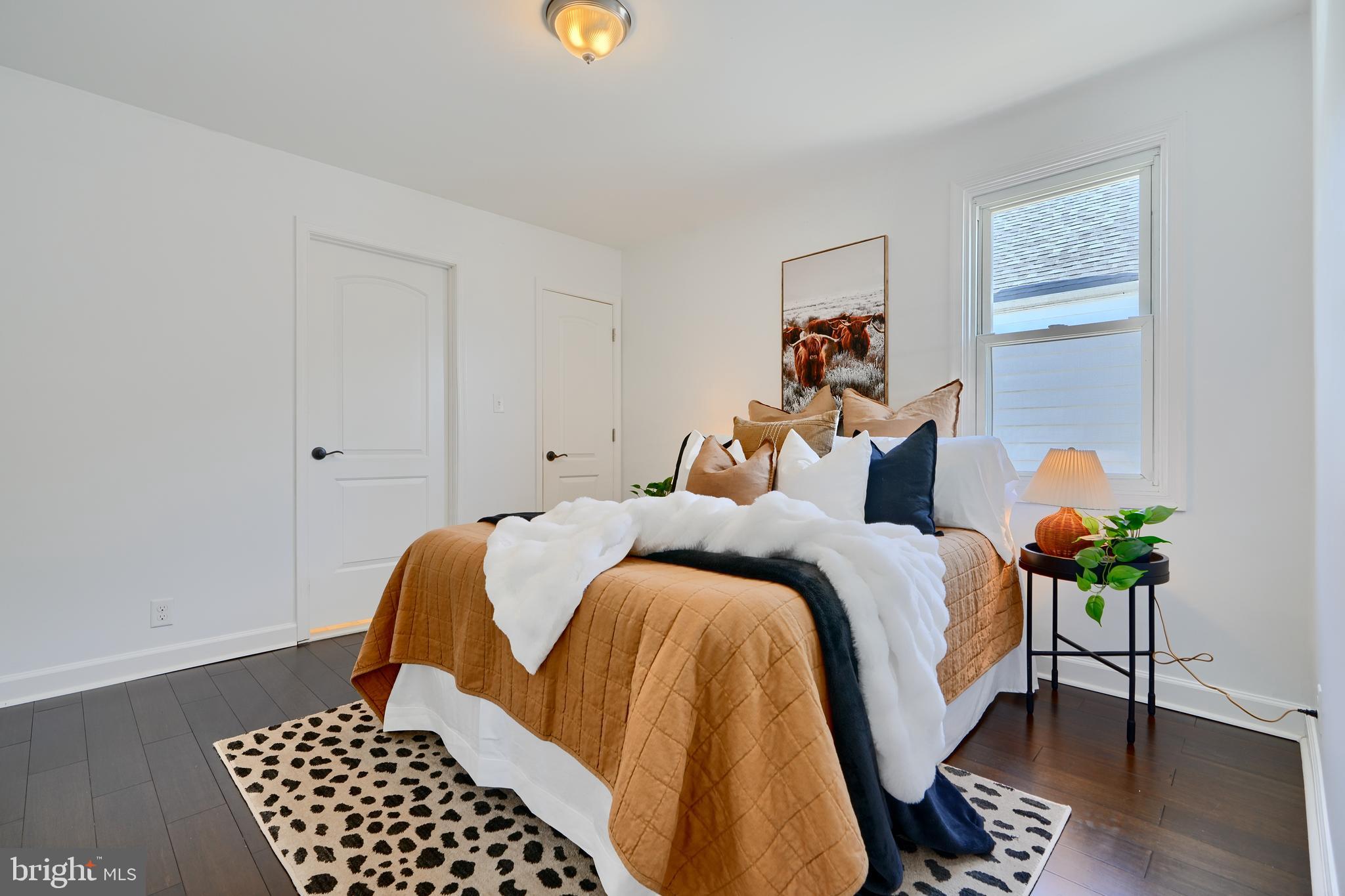 294 Stillwater Road Baltimore, MD 21221 - Photo 15 of 40 a bed room with a bed and a chair