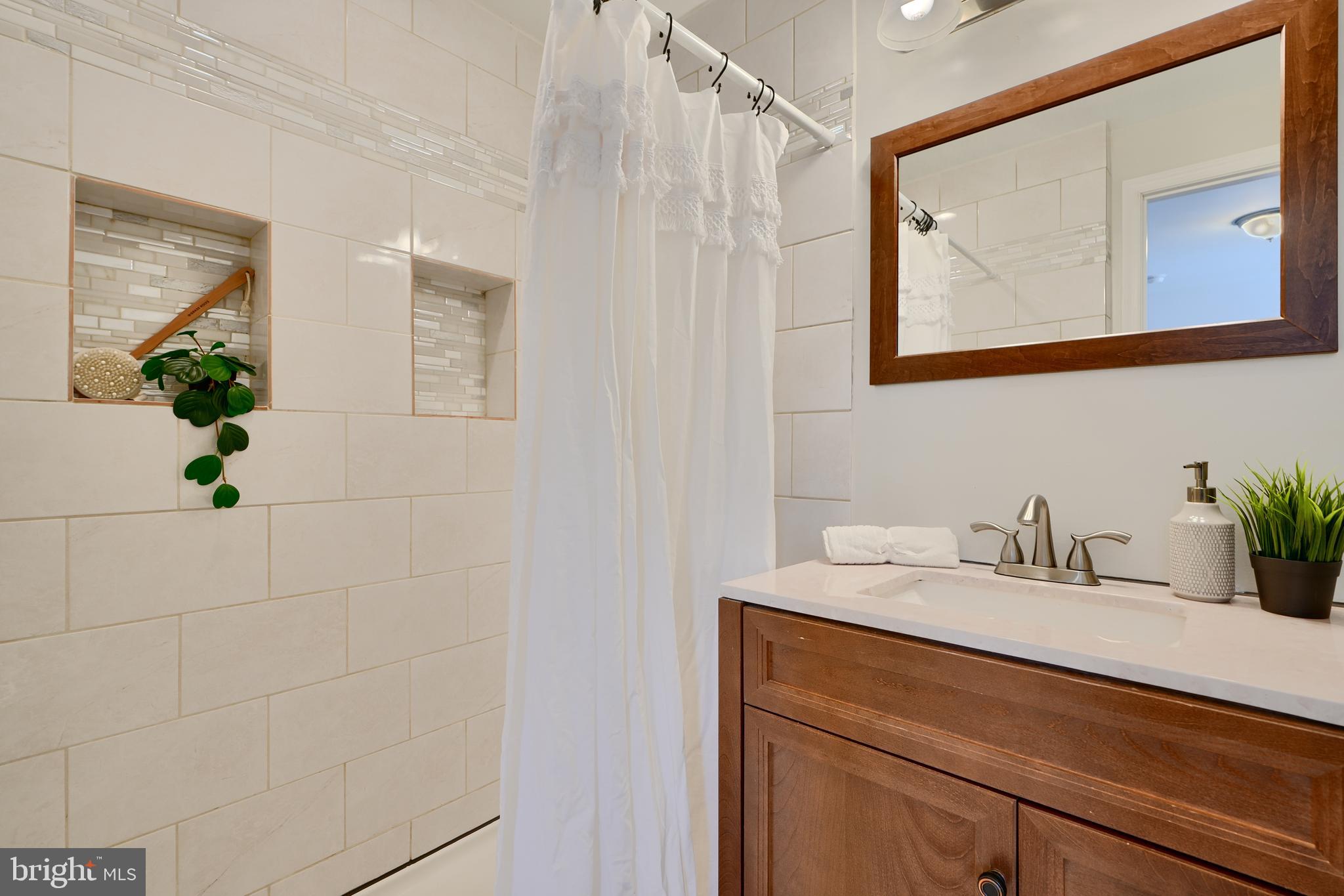 294 Stillwater Road Baltimore, MD 21221 - Photo 19 of 40 a bathroom with a sink and a mirror