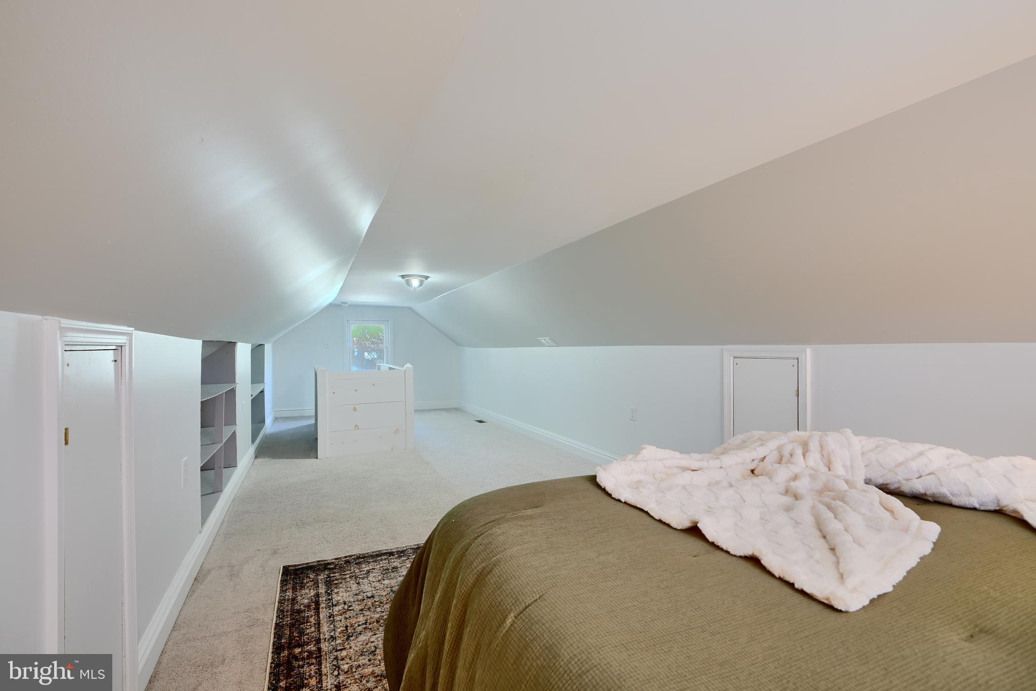 294 Stillwater Road Baltimore, MD 21221 - Photo 27 of 40 a bedroom with a bed and a refrigerator