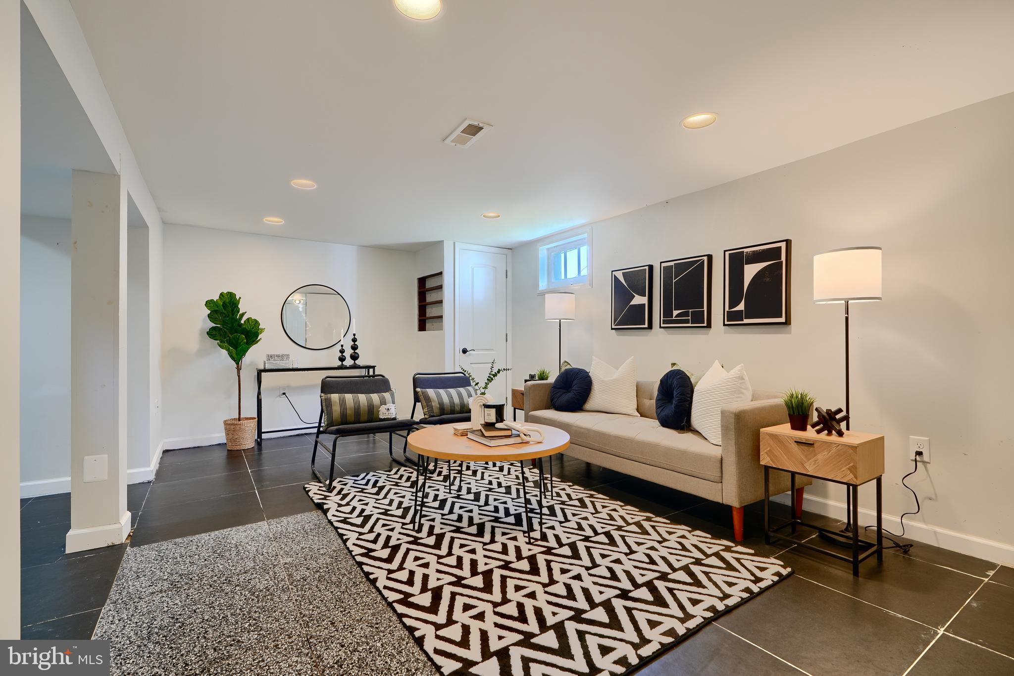294 Stillwater Road Baltimore, MD 21221 - Photo 29 of 40 a living room with furniture rug and window