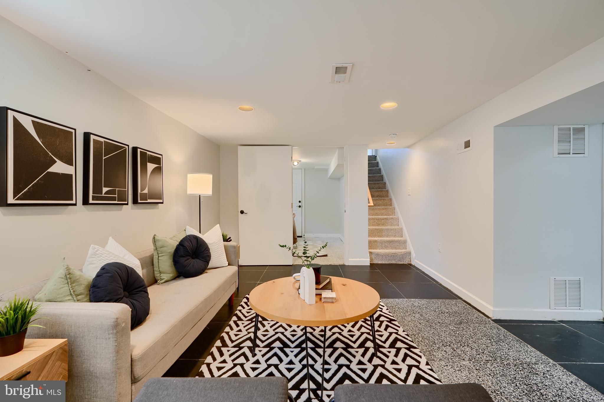 294 Stillwater Road Baltimore, MD 21221 - Photo 30 of 40 a living room with furniture and a wooden floor