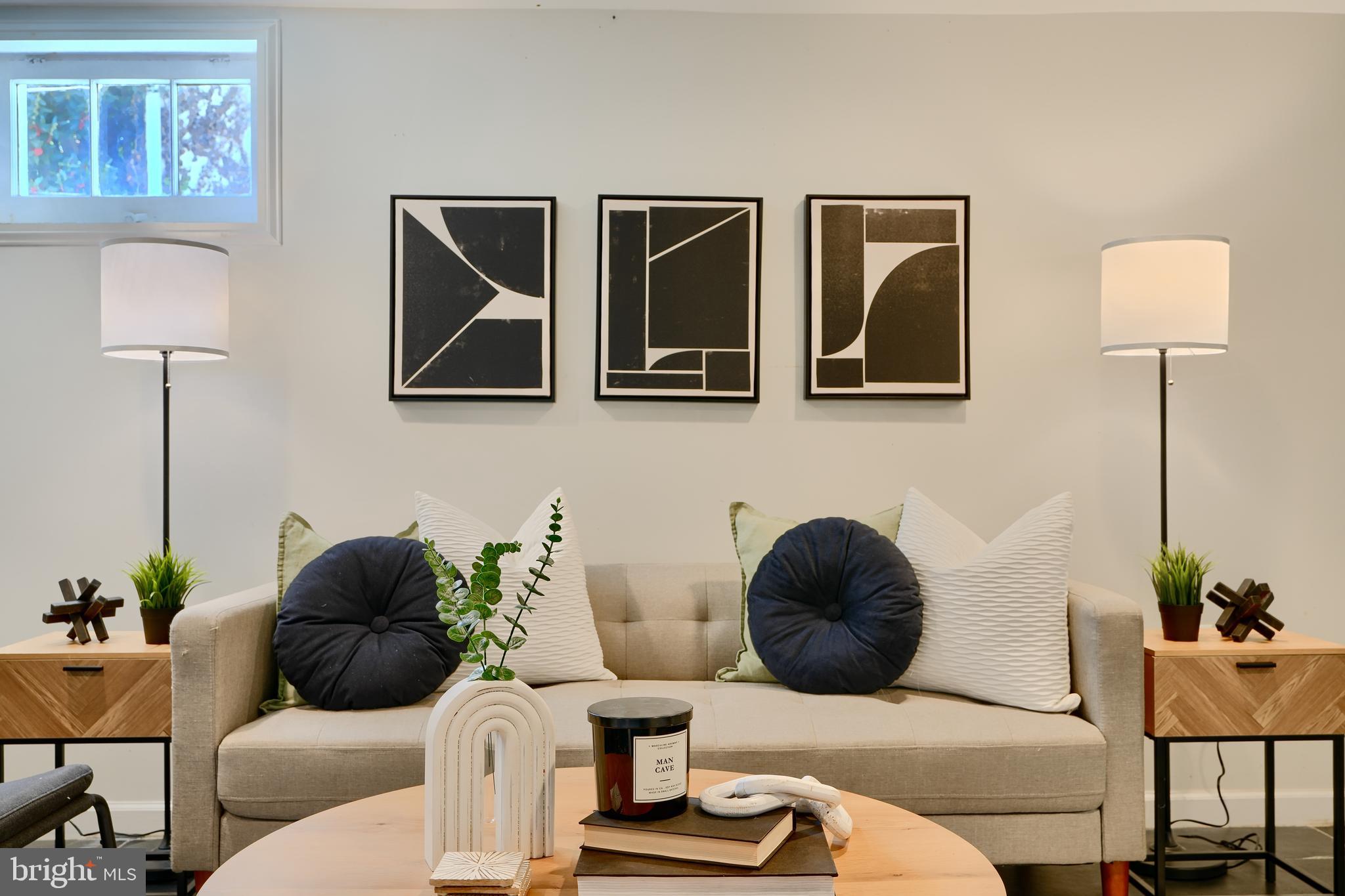 294 Stillwater Road Baltimore, MD 21221 - Photo 31 of 40 a living room with furniture and a lamp