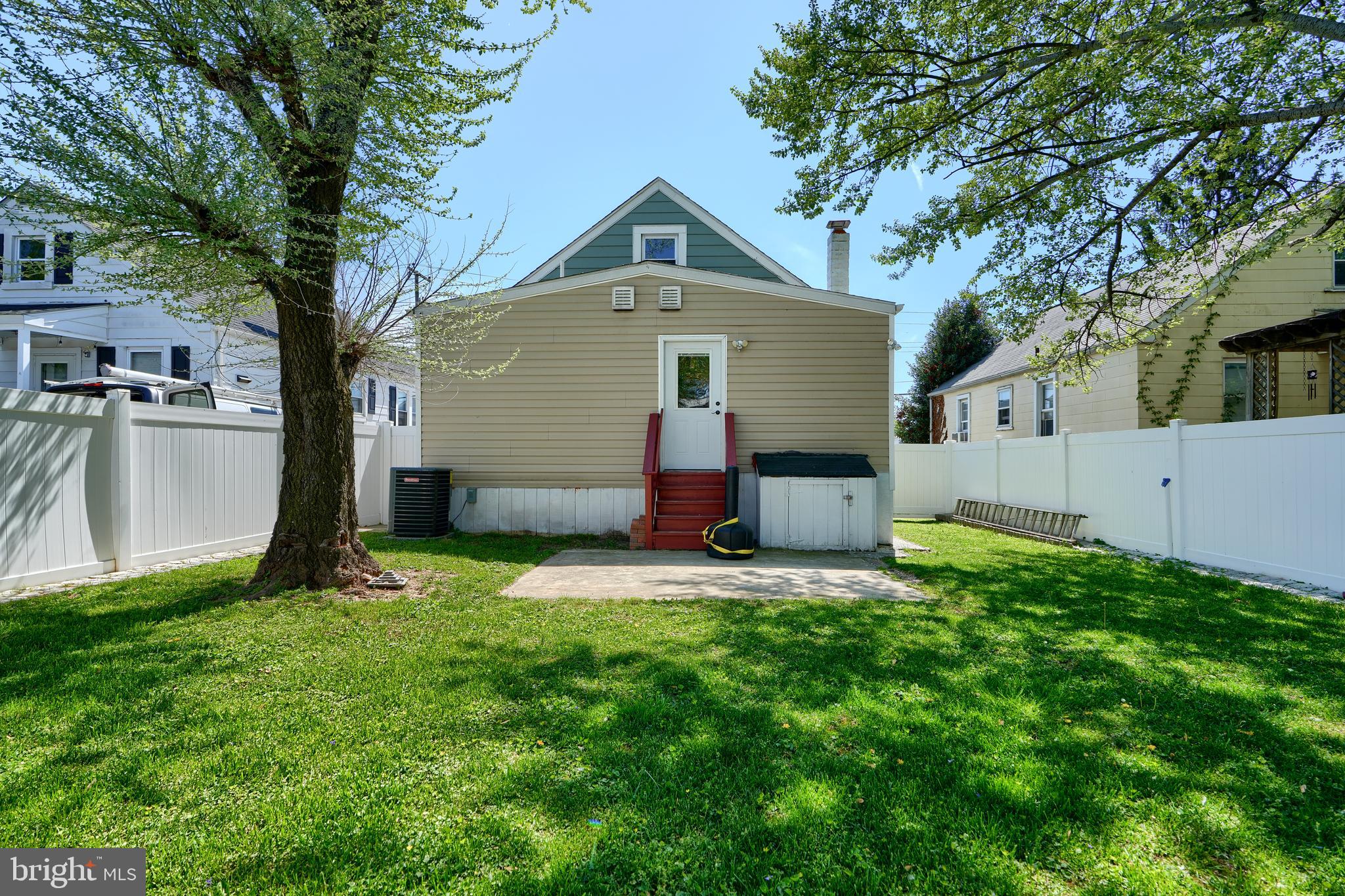 294 Stillwater Road Baltimore, MD 21221 - Photo 39 of 40 a front view of a house with a yard and garage