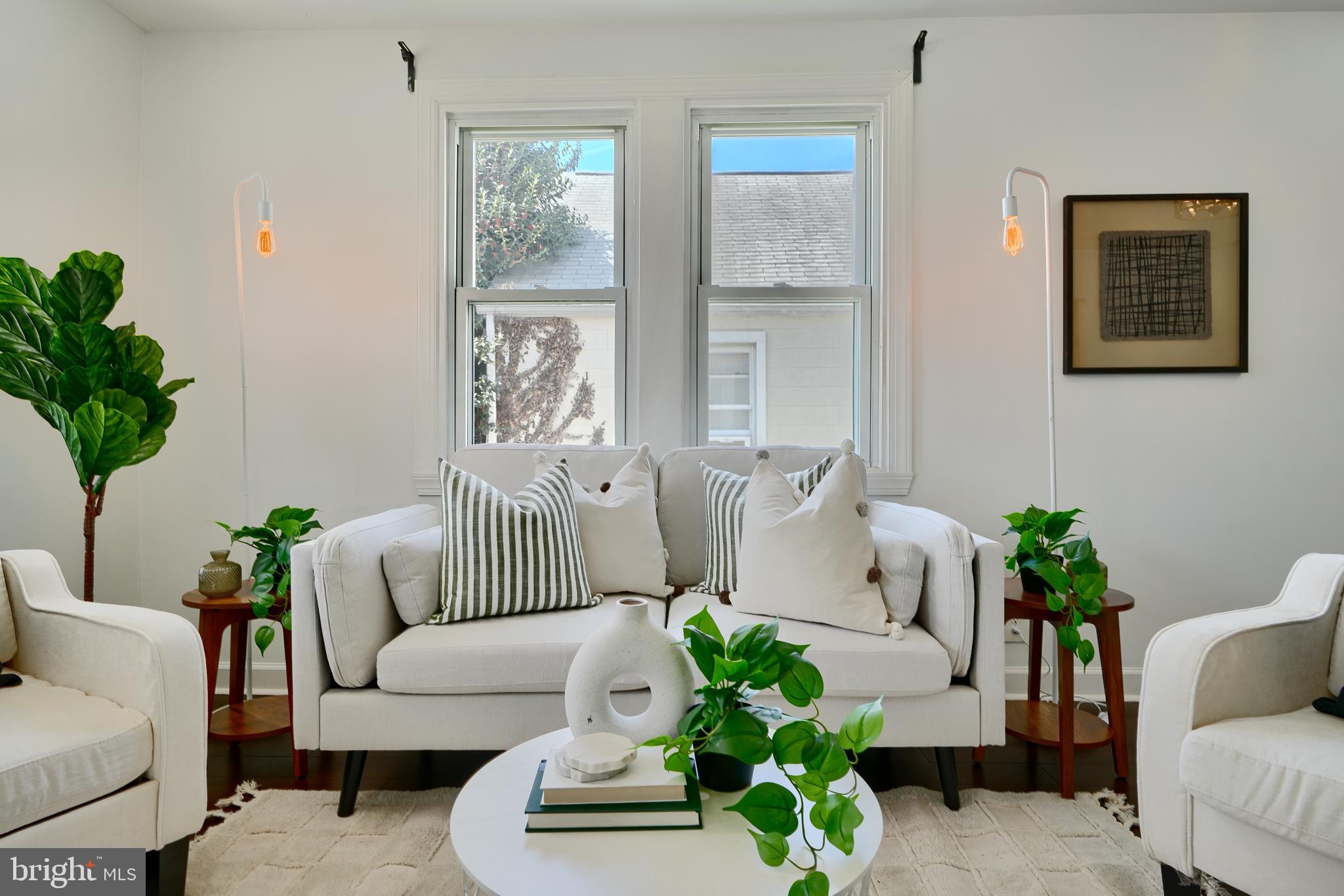 294 Stillwater Road Baltimore, MD 21221 - Photo 4 of 40 a living room with furniture and a potted plant