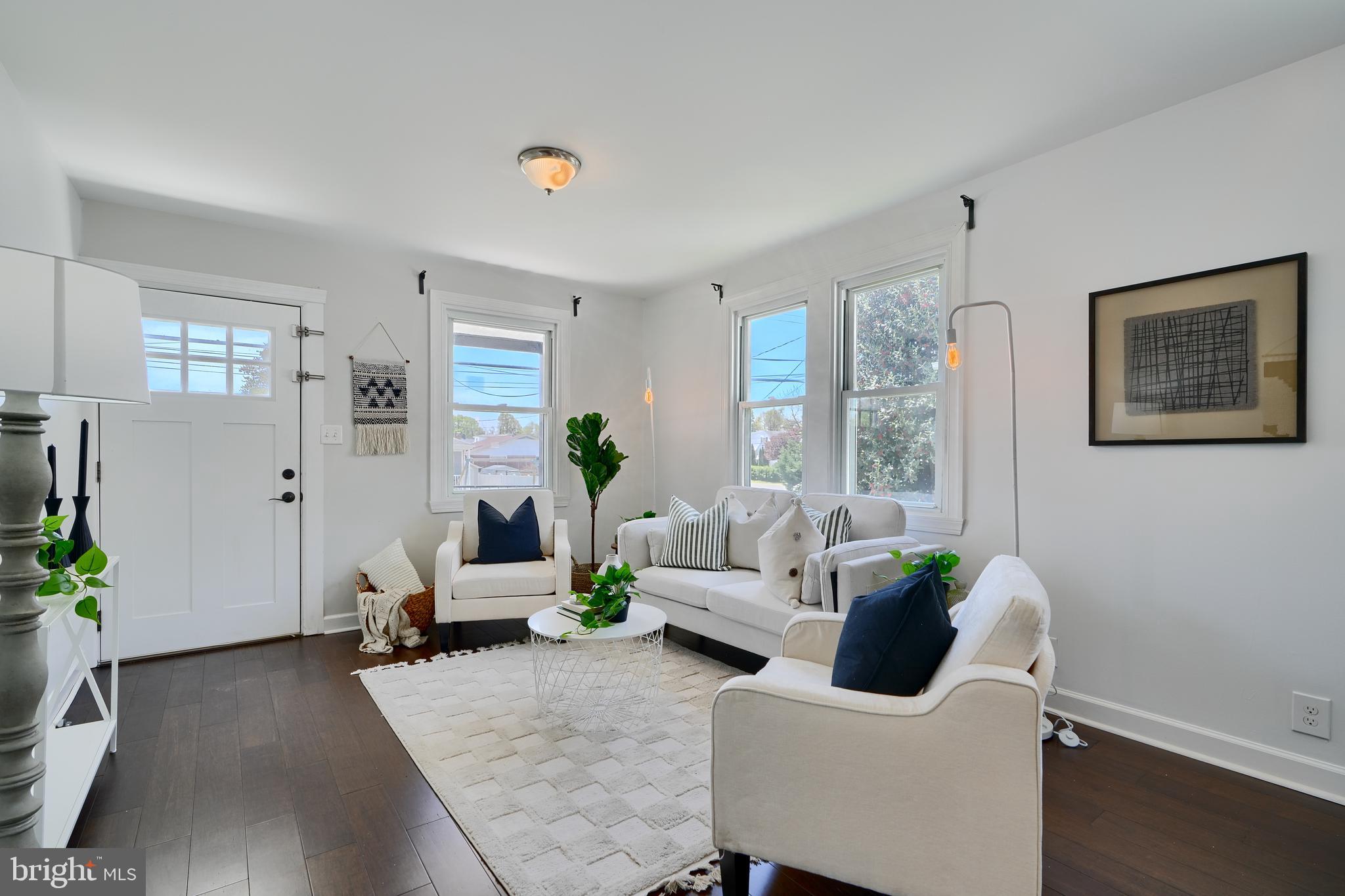 294 Stillwater Road Baltimore, MD 21221 - Photo 7 of 40 a living room with furniture and wooden floor