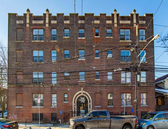 a front view of a building with many windows
