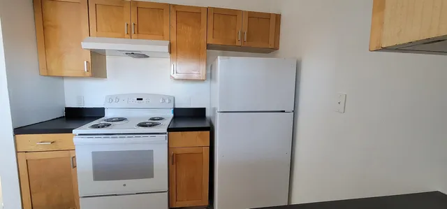 a kitchen with a sink and a window