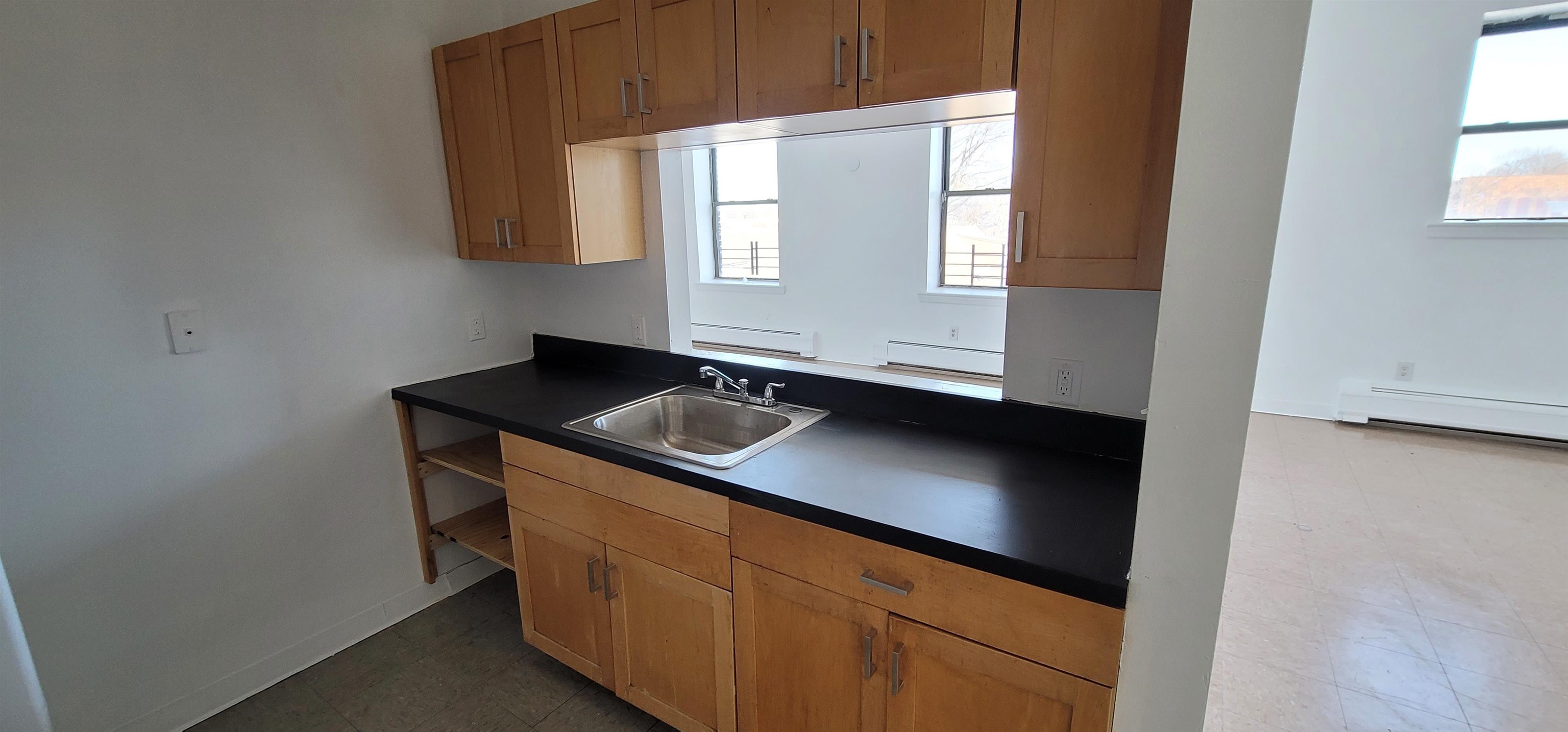 99 Rutgers Avenue, Unit 4C Jersey City, NJ 07305 - Photo 13 of 13 a kitchen with a sink and a window