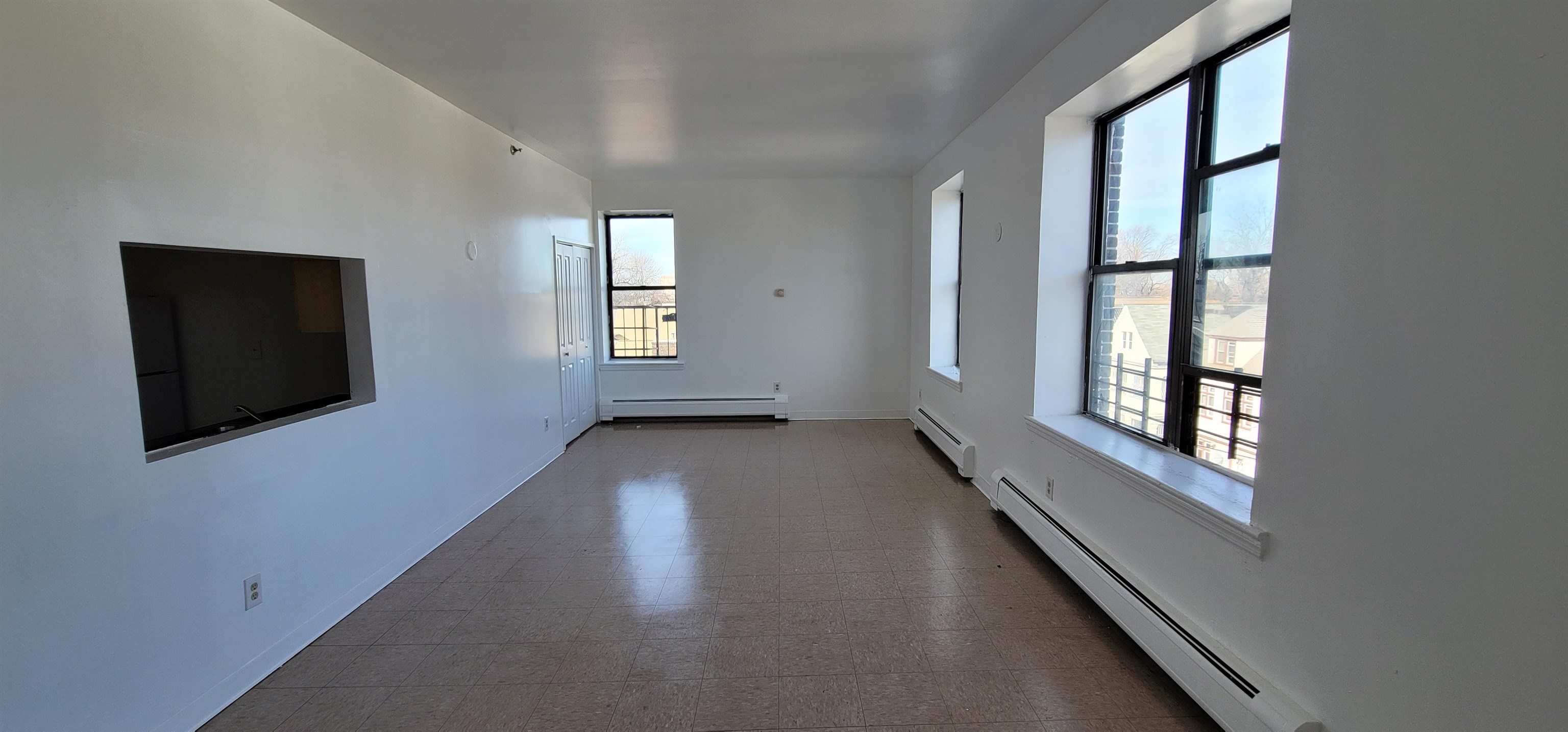 99 Rutgers Avenue, Unit 4C Jersey City, NJ 07305 - Photo 4 of 13 an empty room with windows
