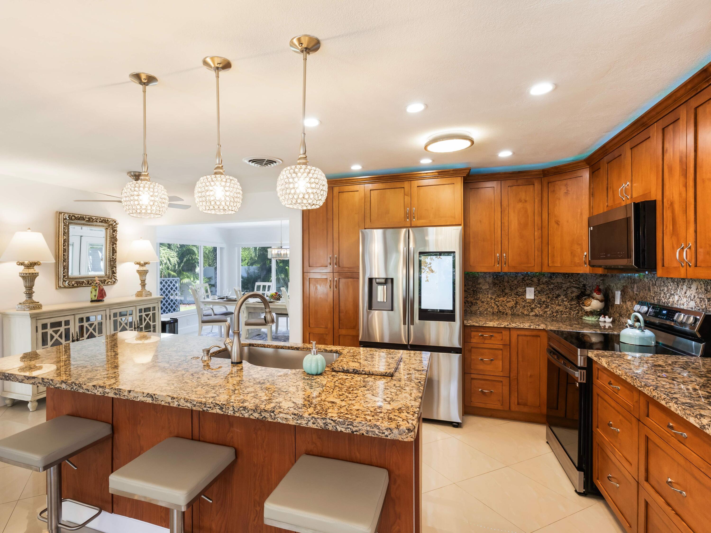 301 Northeast 23rd Street Boca Raton, FL 33431 - Photo 14 of 43 a kitchen with lots of counter space windows and a sink