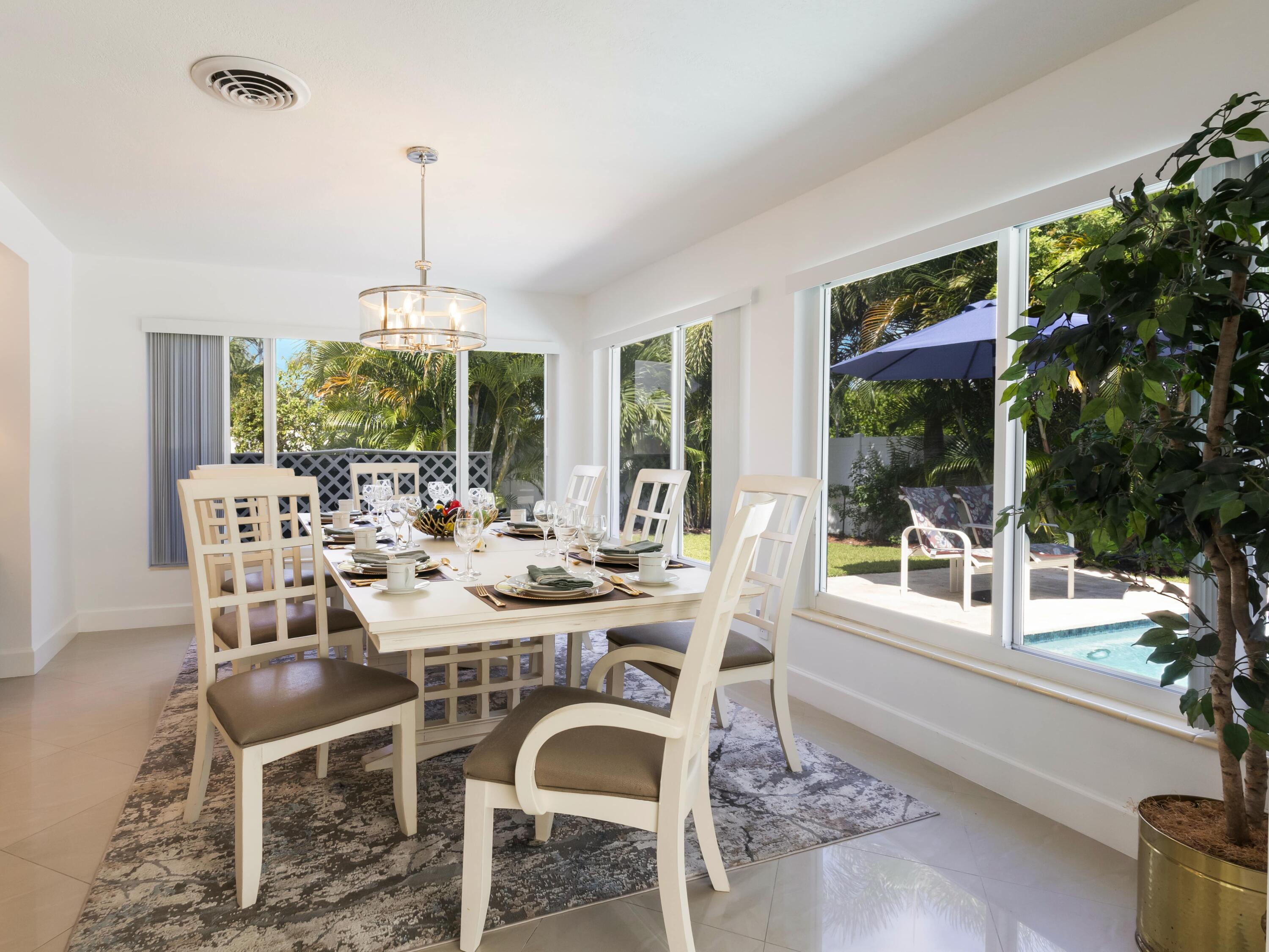 301 Northeast 23rd Street Boca Raton, FL 33431 - Photo 17 of 43 a view of a dining room with furniture window and outside view