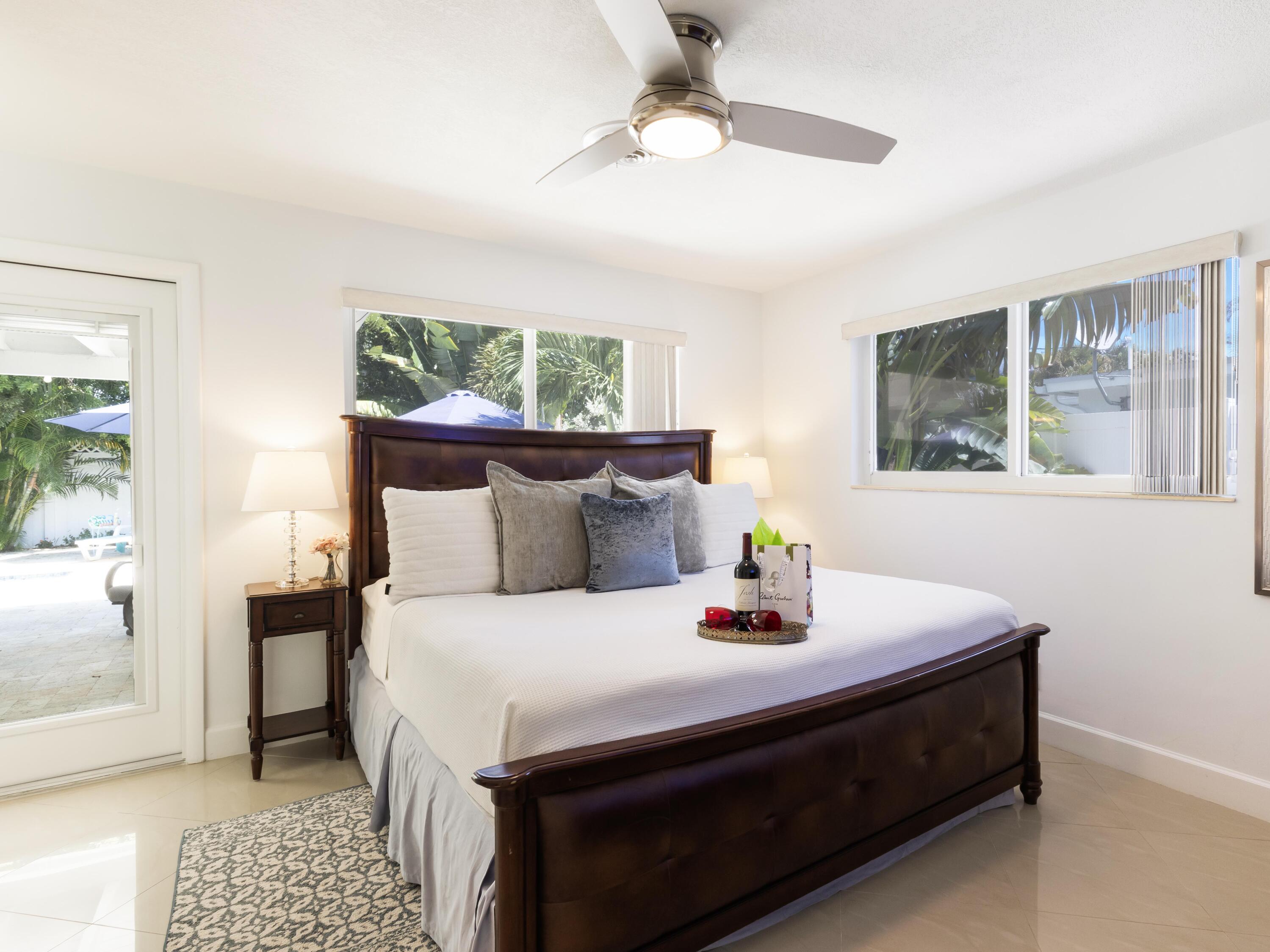 301 Northeast 23rd Street Boca Raton, FL 33431 - Photo 19 of 43 a bedroom with bed and window