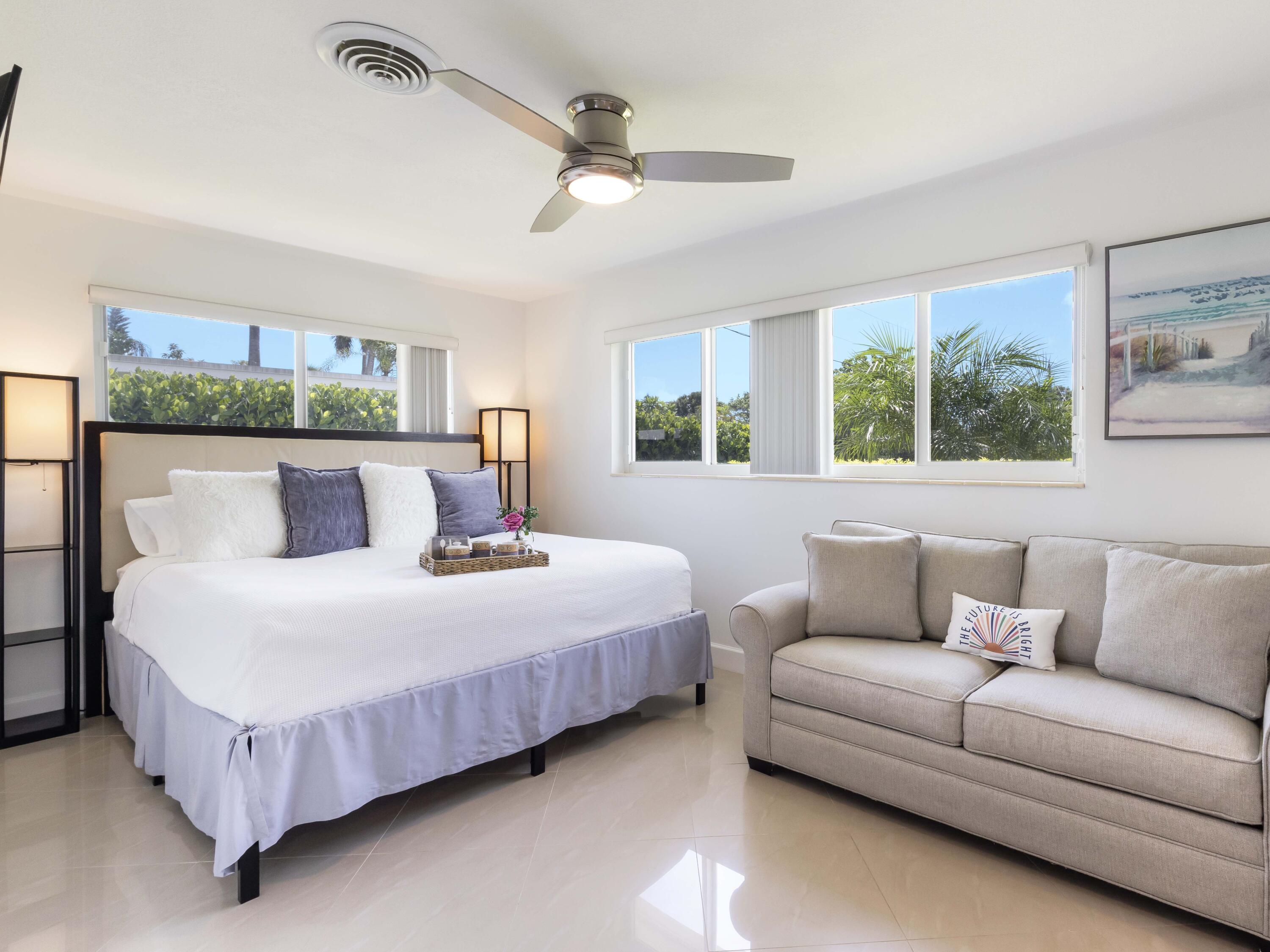 301 Northeast 23rd Street Boca Raton, FL 33431 - Photo 24 of 43 a bedroom with a bed couch and window