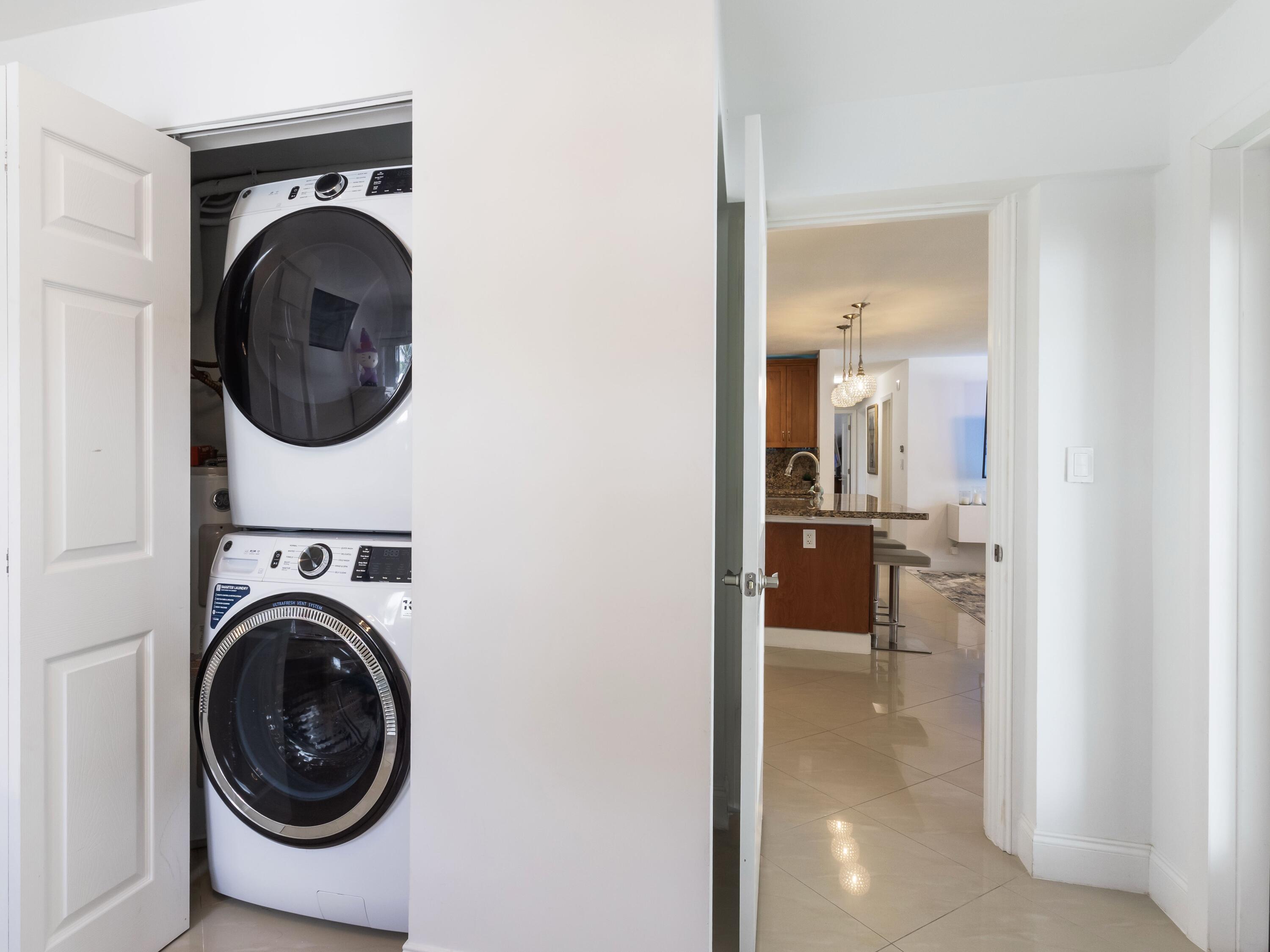 301 Northeast 23rd Street Boca Raton, FL 33431 - Photo 29 of 43 a view of a hallway and a washer and dryer