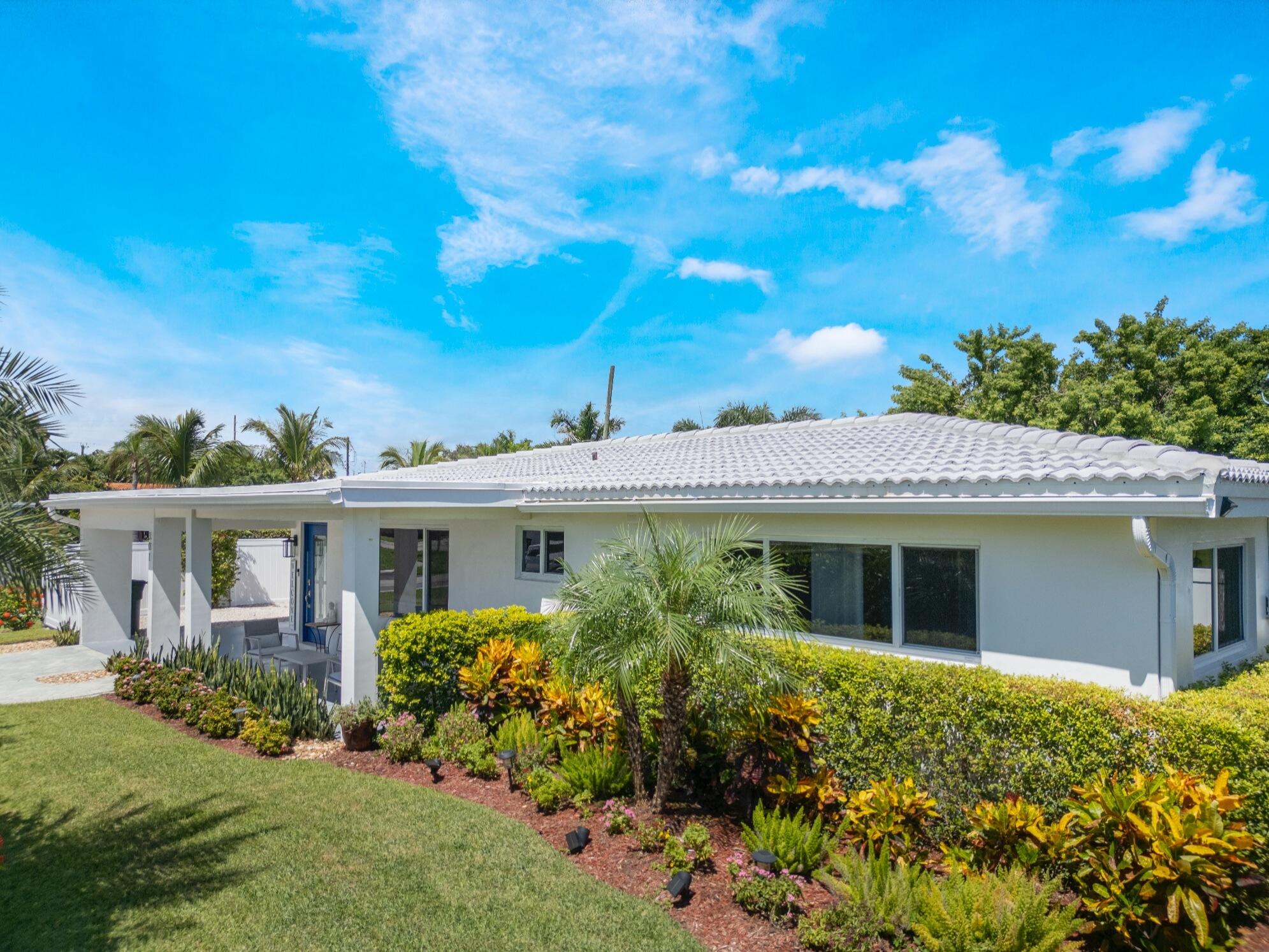 301 Northeast 23rd Street Boca Raton, FL 33431 - Photo 3 of 43 front view of house with a yard