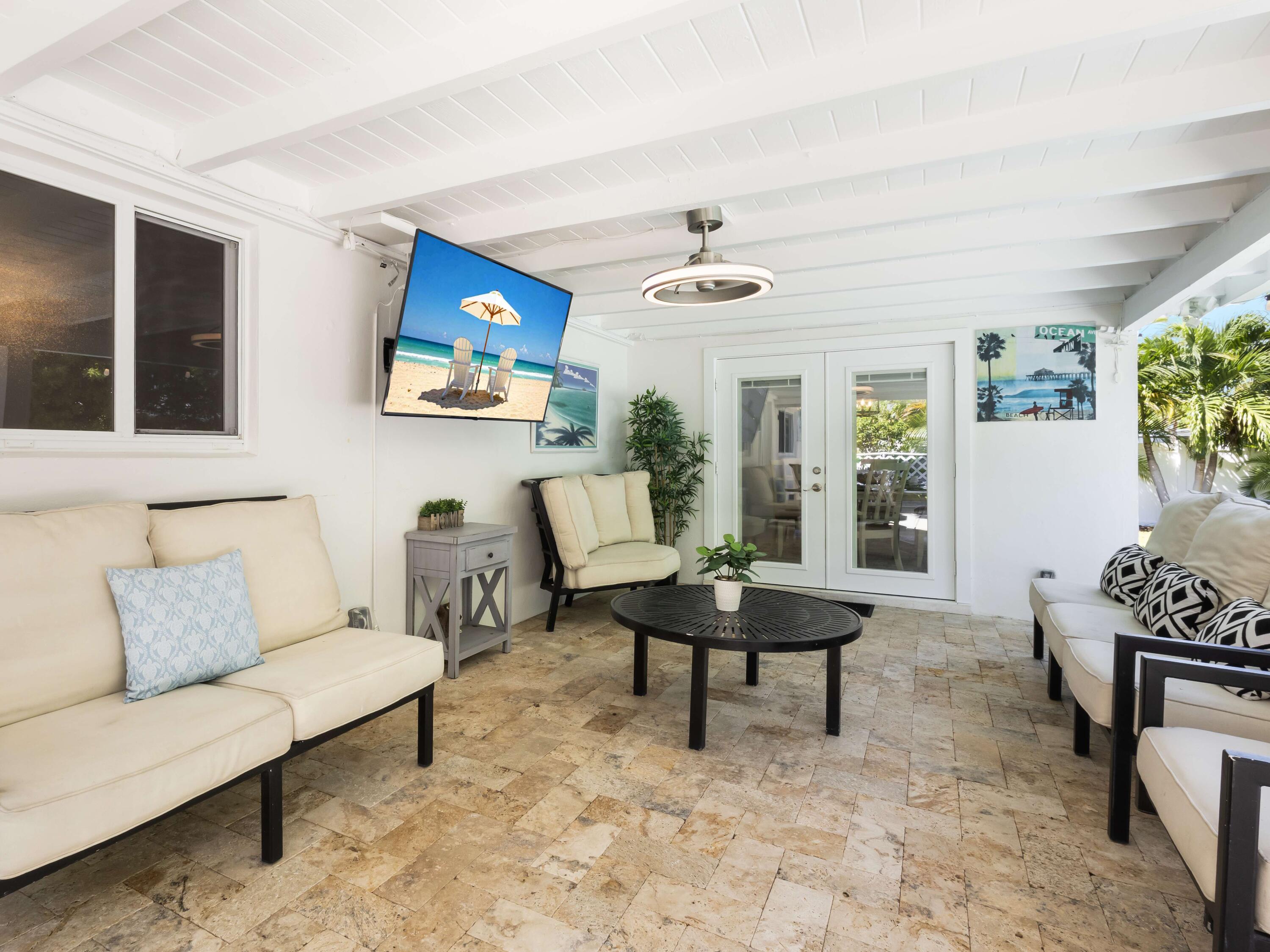 301 Northeast 23rd Street Boca Raton, FL 33431 - Photo 31 of 43 a living room with furniture and a painting on the wall