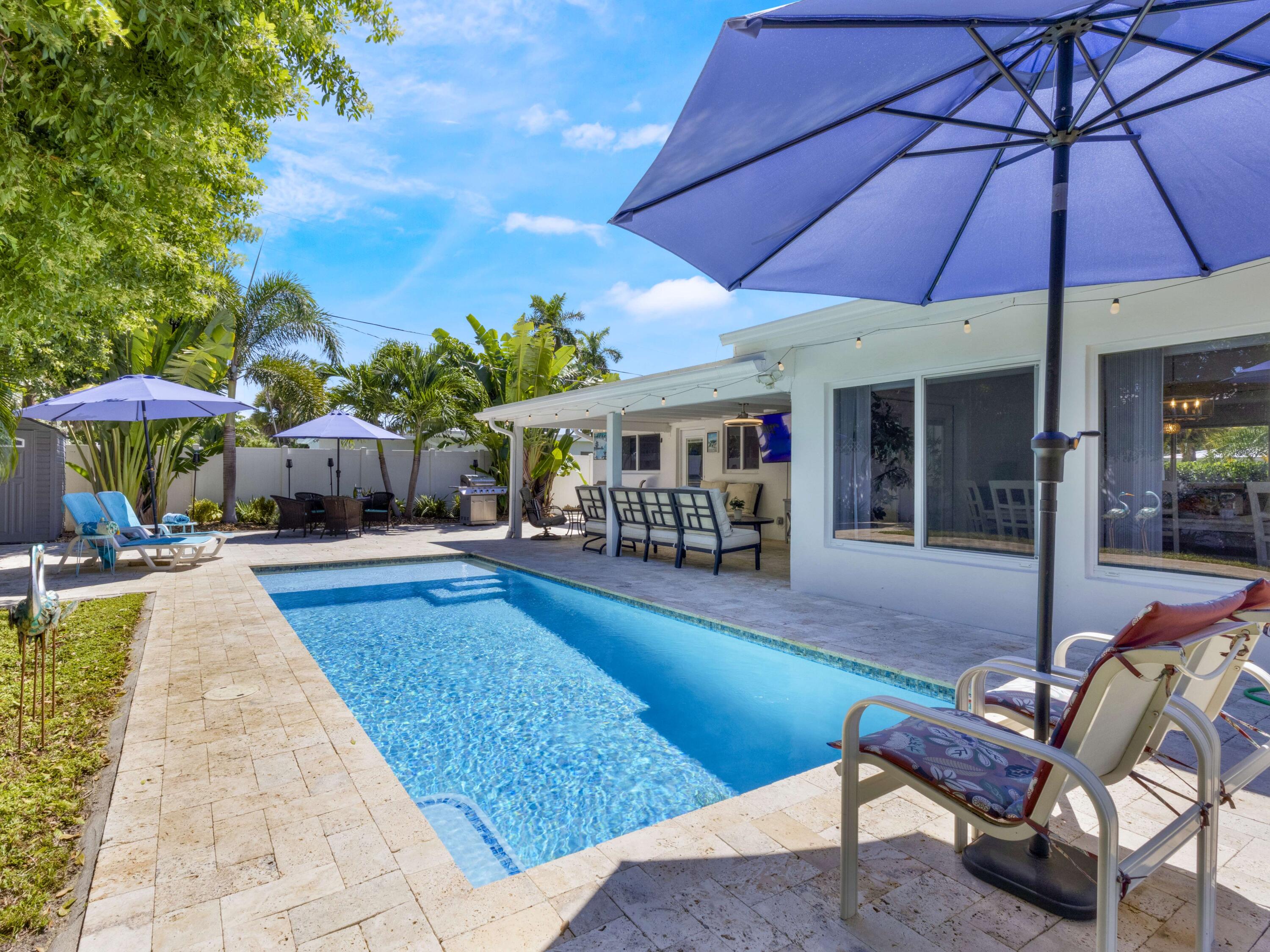301 Northeast 23rd Street Boca Raton, FL 33431 - Photo 35 of 43 a view of a house with swimming pool and sitting area
