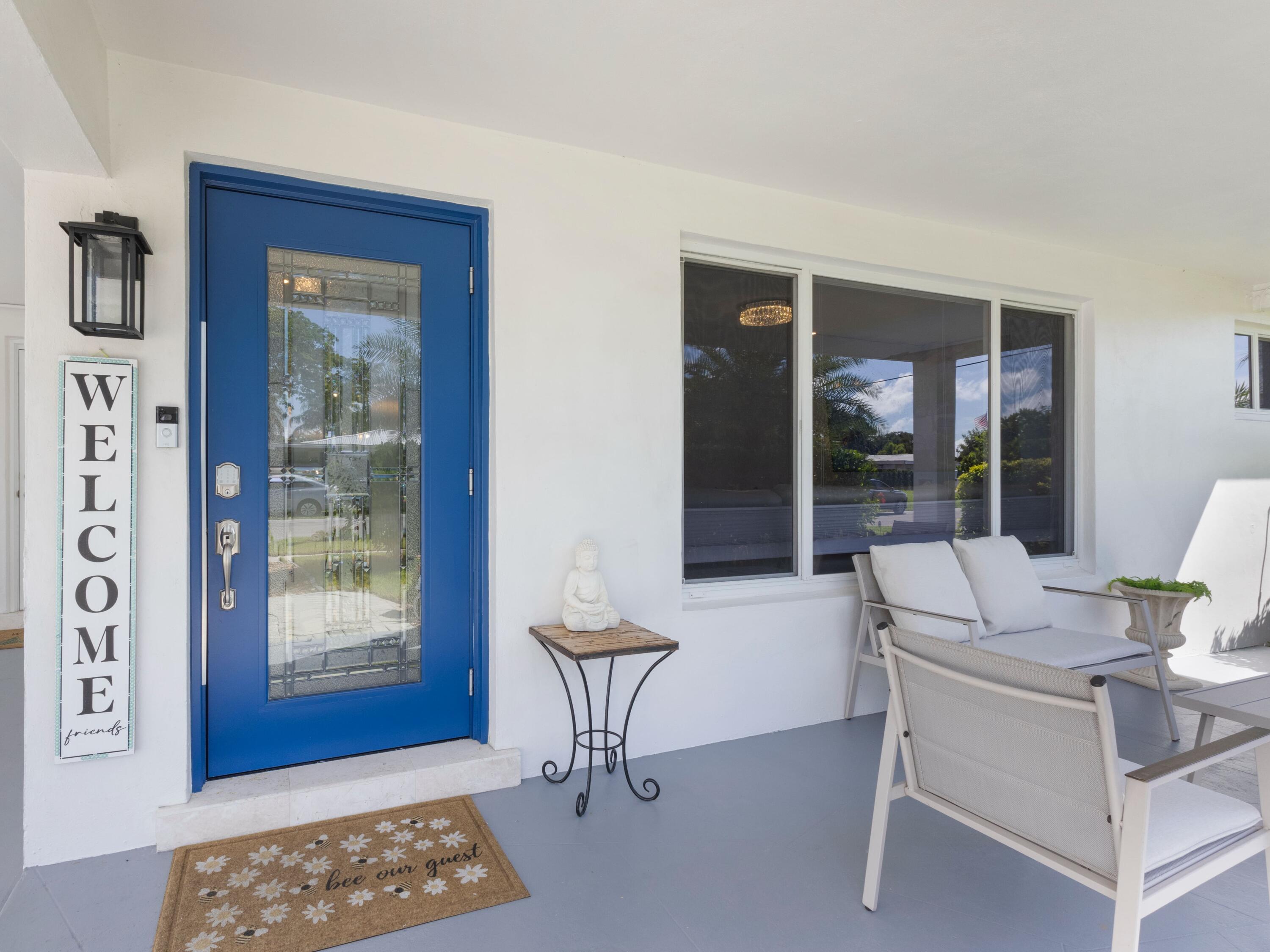 301 Northeast 23rd Street Boca Raton, FL 33431 - Photo 5 of 43 a living room with furniture a window and a table