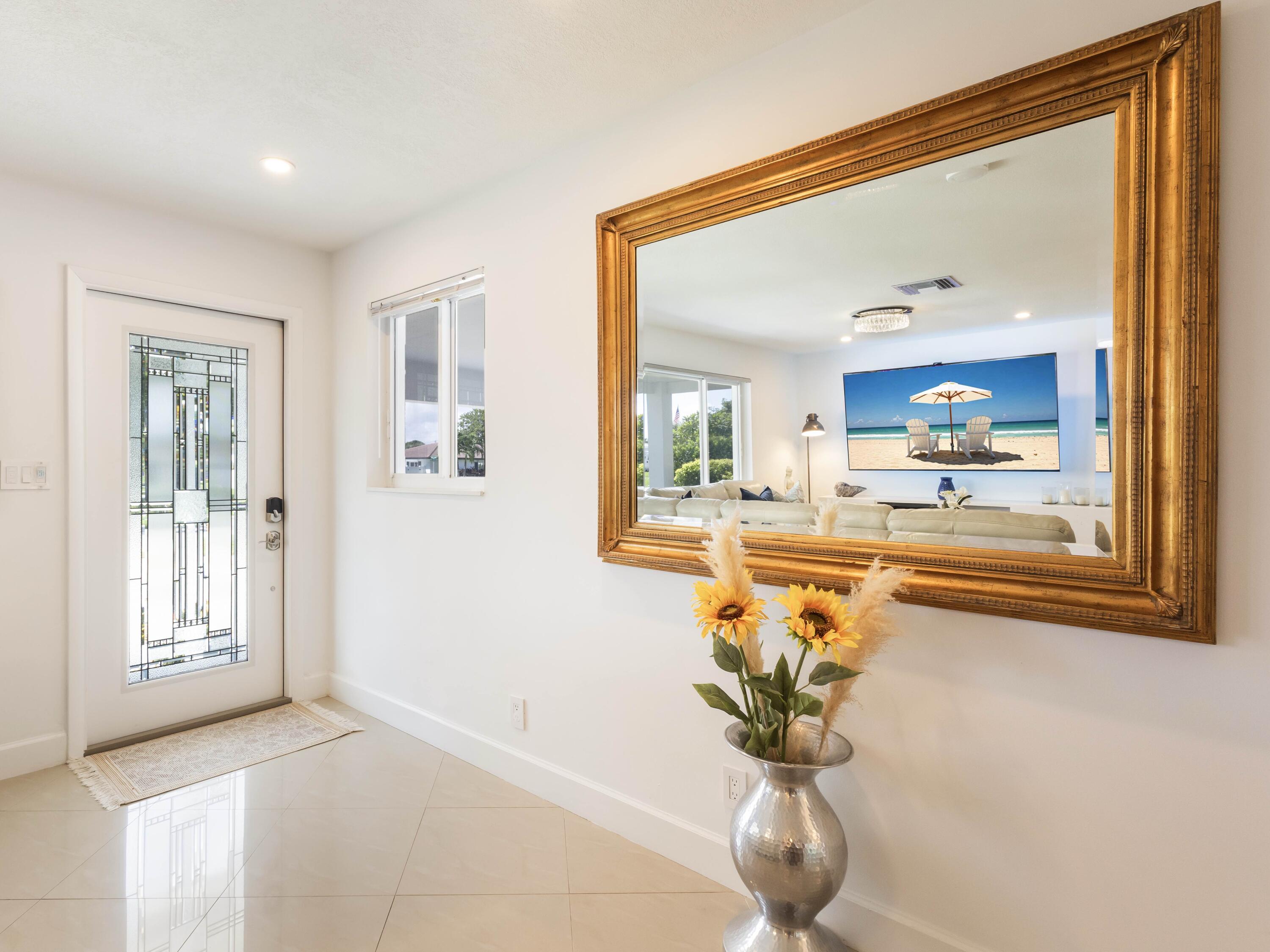 301 Northeast 23rd Street Boca Raton, FL 33431 - Photo 8 of 43 a view of a living room and a chandelier