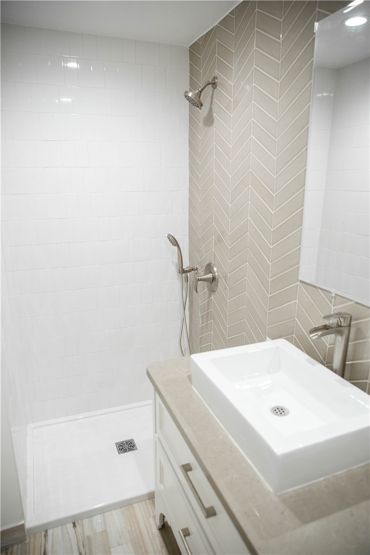 5908 Atlantic Avenue, Unit D Long Beach, CA 90805 - Photo 22 of 36 a bathroom with a white bath tub
