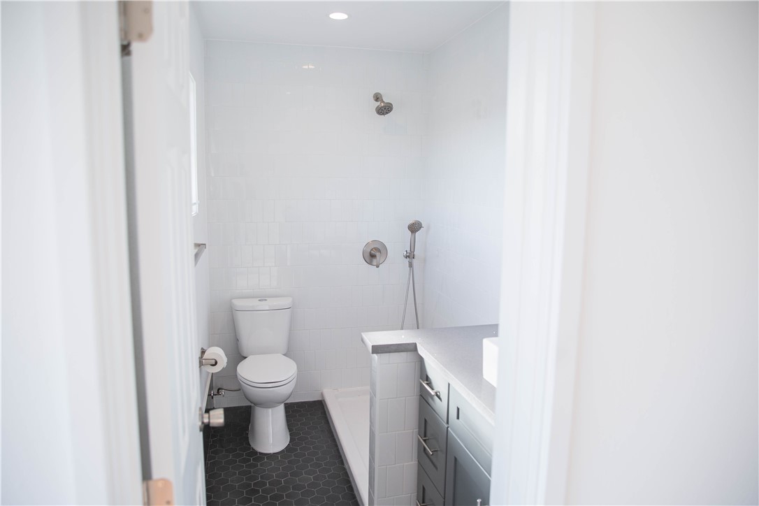 5908 Atlantic Avenue, Unit D Long Beach, CA 90805 - Photo 28 of 36 a bathroom with a toilet and a shower