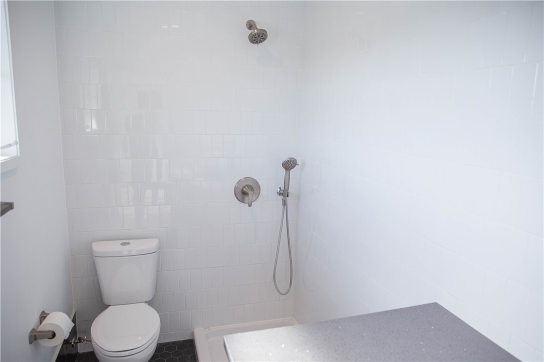 5908 Atlantic Avenue, Unit D Long Beach, CA 90805 - Photo 4 of 36 a bathroom with a toilet and a shower