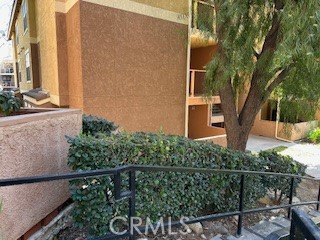 10655 Lemon Avenue, Unit 3401 Rancho Cucamonga, CA 91737 - Photo 3 of 27 a front view of a house with plants