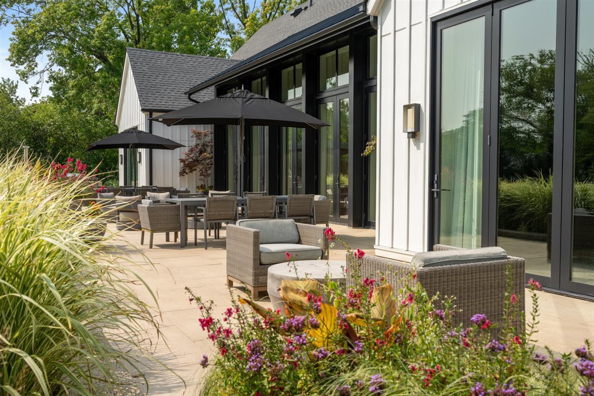 2064 Norfork Road Northfield, IL 60093 - Photo 25 of 63 a view of a house with backyard sitting area and garden