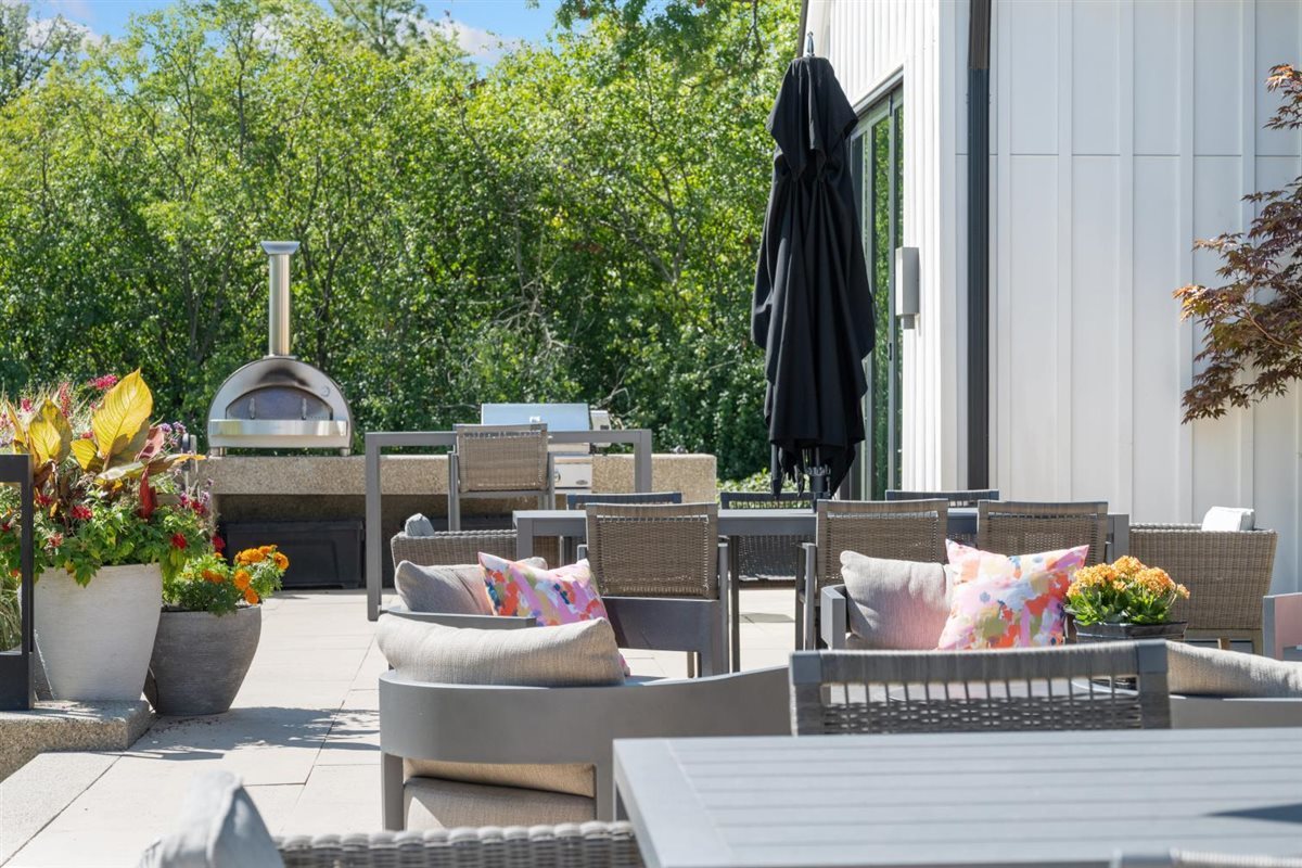 2064 Norfork Road Northfield, IL 60093 - Photo 10 of 63 a view of a patio with couches and a potted plant on a table