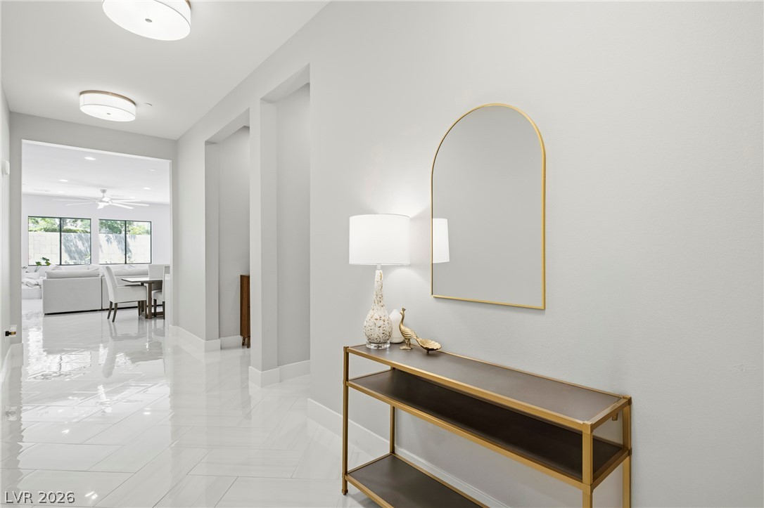 45 Garibaldi Way Henderson, NV 89011 - Photo 16 of 74 A graceful entry with polished floors leads into an open-concept living area.