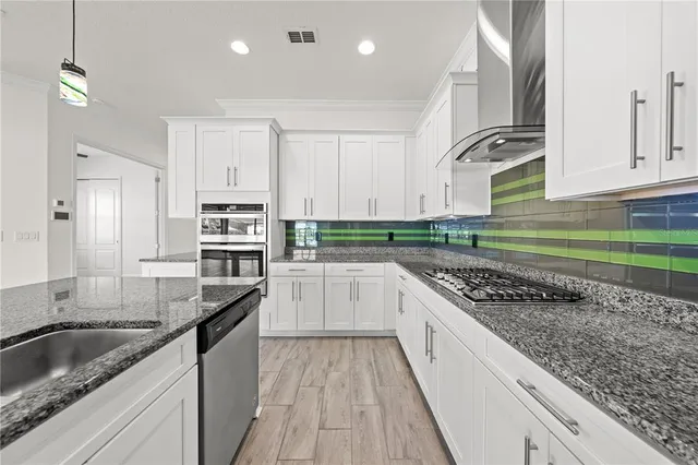 an aerial view of a house with a swimming pool