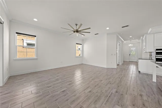 a bathroom with a granite countertop sink toilet a mirror and bathtub