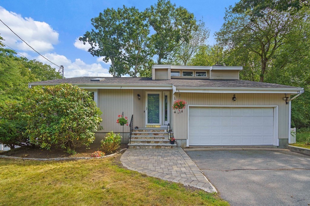 118 Beach Road Salisbury, MA 01952 - Photo 3 of 29 a front view of a house with garden