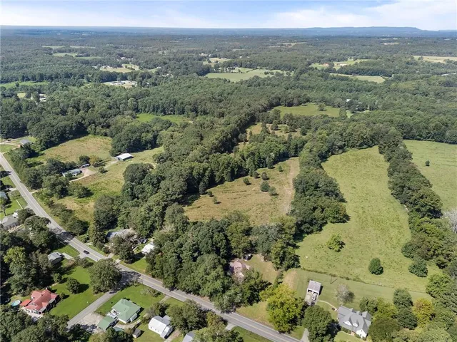 a front view of house with yard and trees
