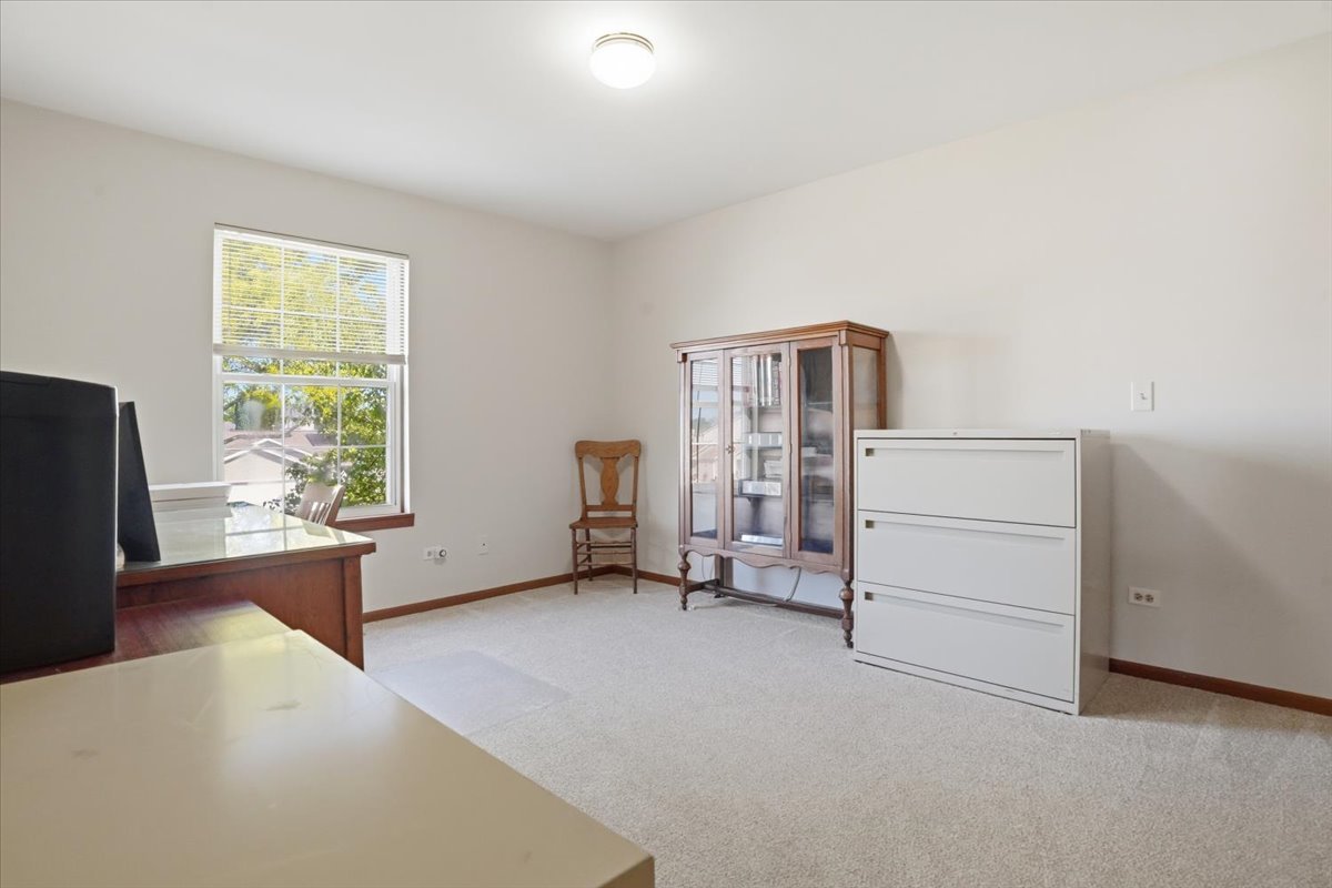 3413 Harbor Ridge Drive Zion, IL 60099 - Photo 22 of 37 a view of a bedroom with furniture and windows