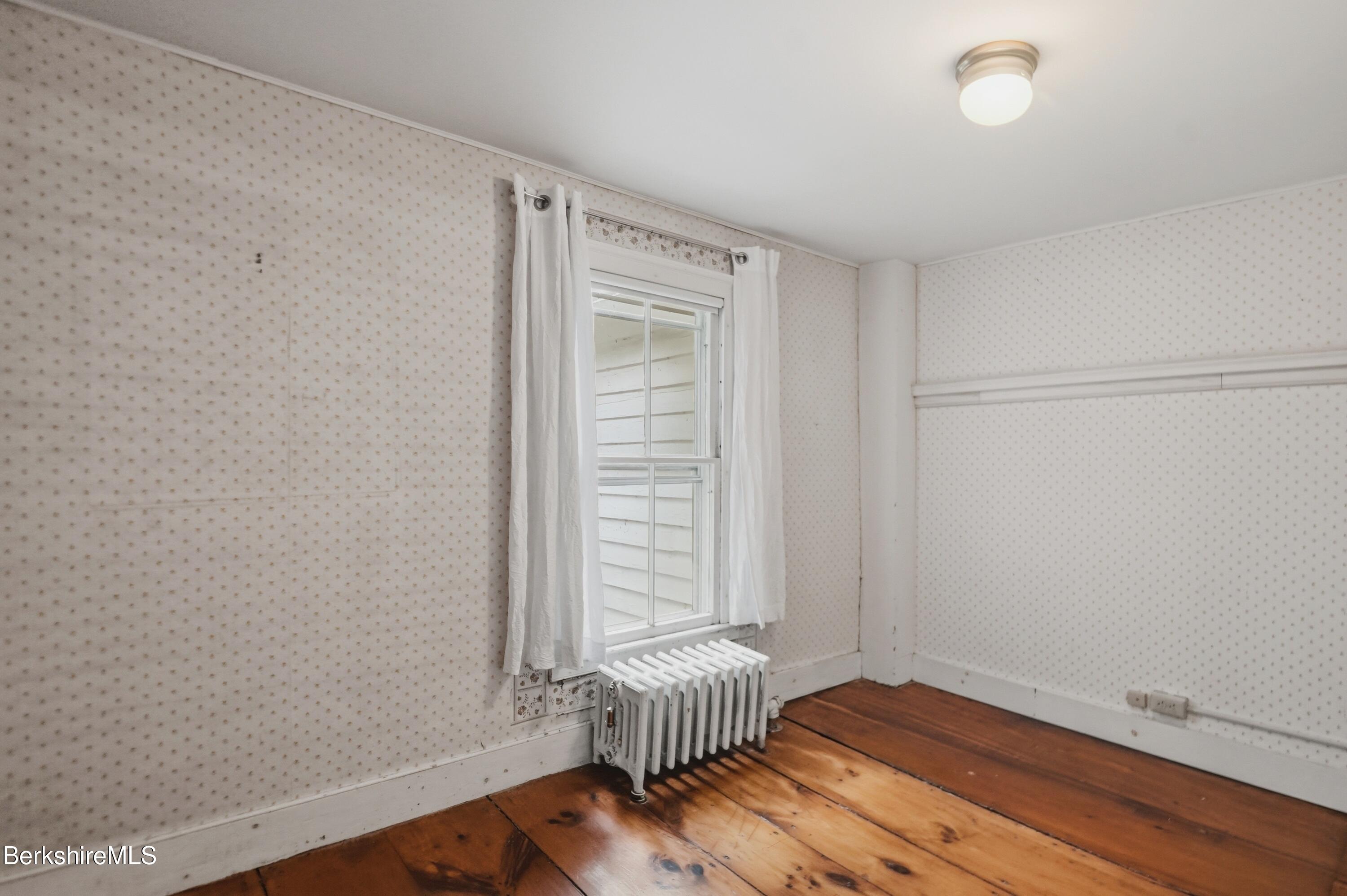 4 Stockbridge Road West Stockbridge, MA 01266 - Photo 62 of 94 an empty room with wooden floor and windows