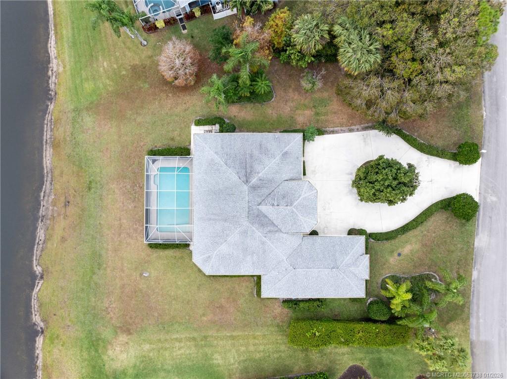 800 Southeast Waterside Way Stuart, FL 34997 - Photo 4 of 27 an aerial view of a house with a yard and a large tree