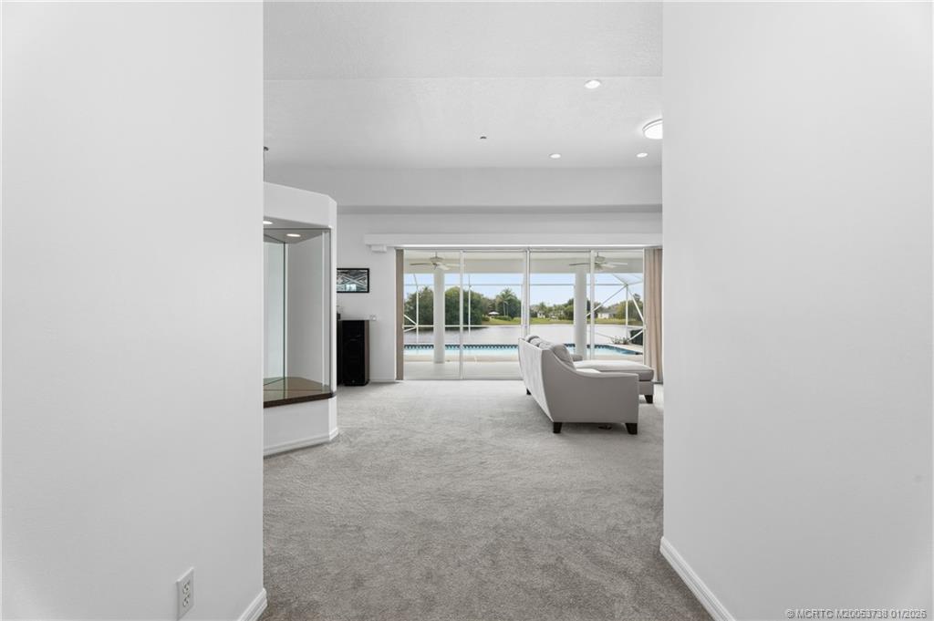 800 Southeast Waterside Way Stuart, FL 34997 - Photo 8 of 27 a living room with furniture and a large window